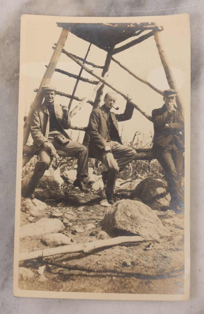Lot 098 - Single Antique Snapshot Photograph Of Three Men Enjoying A Smoke And A Snack On A Hike By Watchtower