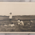 Lot 102 - Single Antique Snapshot Photograph Of A Group Of Young Men In A Field, One Taking A Photo, Another Looking Through Binoculars