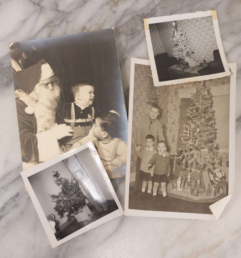 Lot 107 - Grouping Of Four Vintage Christmas Photographs Including Kids Scared Of Santa, And Photos By Christmas Tree