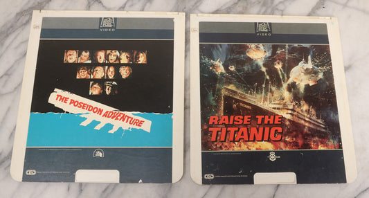 Lot 119 - Pair Of Vintage Nordical Adventure Movie Video Discs, Capacitance Electronic Disc (CED), Including "Raise The Titanic" (1980) And "The Poseidon Adventure" (1972)