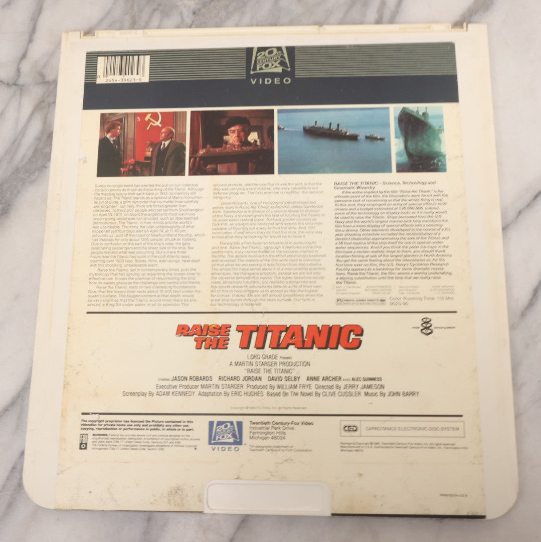 Lot 119 - Pair Of Vintage Nordical Adventure Movie Video Discs, Capacitance Electronic Disc (CED), Including "Raise The Titanic" (1980) And "The Poseidon Adventure" (1972)