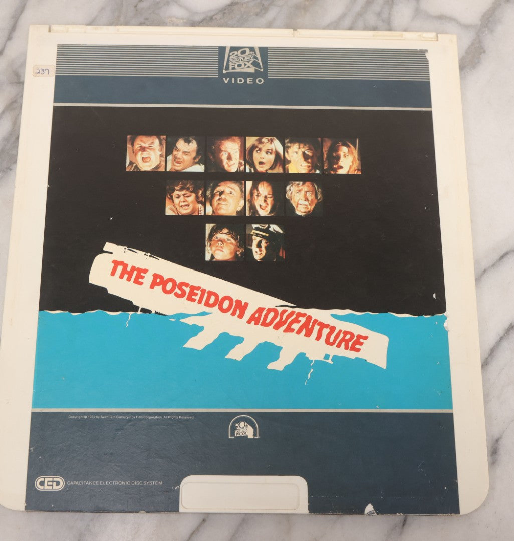 Lot 119 - Pair Of Vintage Nordical Adventure Movie Video Discs, Capacitance Electronic Disc (CED), Including "Raise The Titanic" (1980) And "The Poseidon Adventure" (1972)