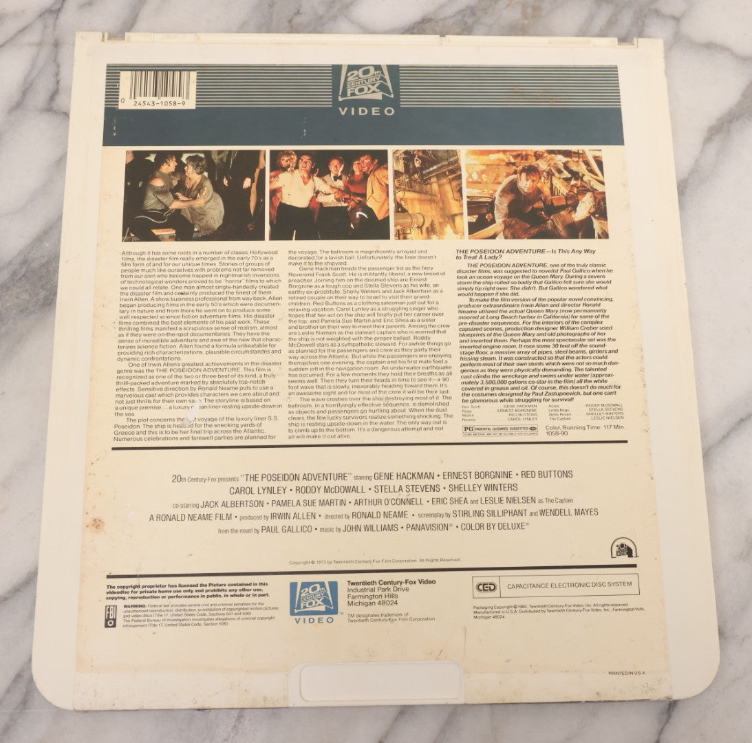 Lot 119 - Pair Of Vintage Nordical Adventure Movie Video Discs, Capacitance Electronic Disc (CED), Including "Raise The Titanic" (1980) And "The Poseidon Adventure" (1972)