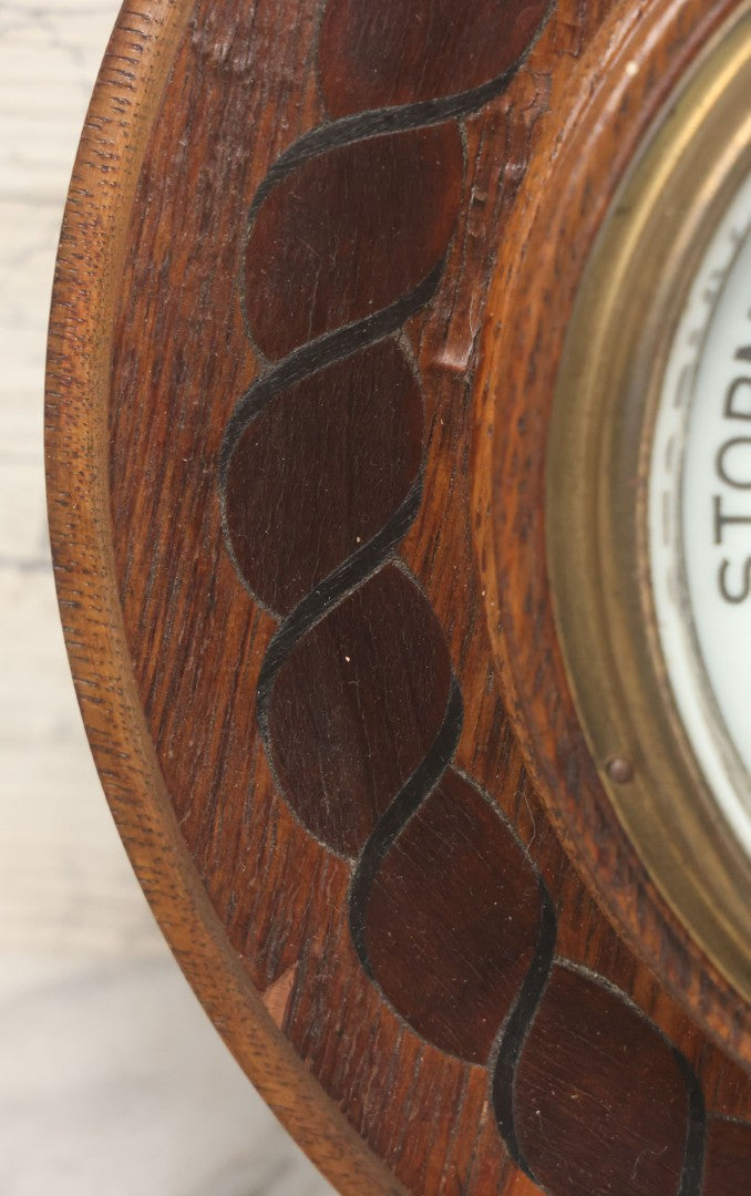 Lot 022 - Vintage Aneroid Barometer On Wood Plaque With Twisted Rope Inlay Motif, Beveled Glass Brass Surround, Wall Hanger, 9-3/4" Diameter