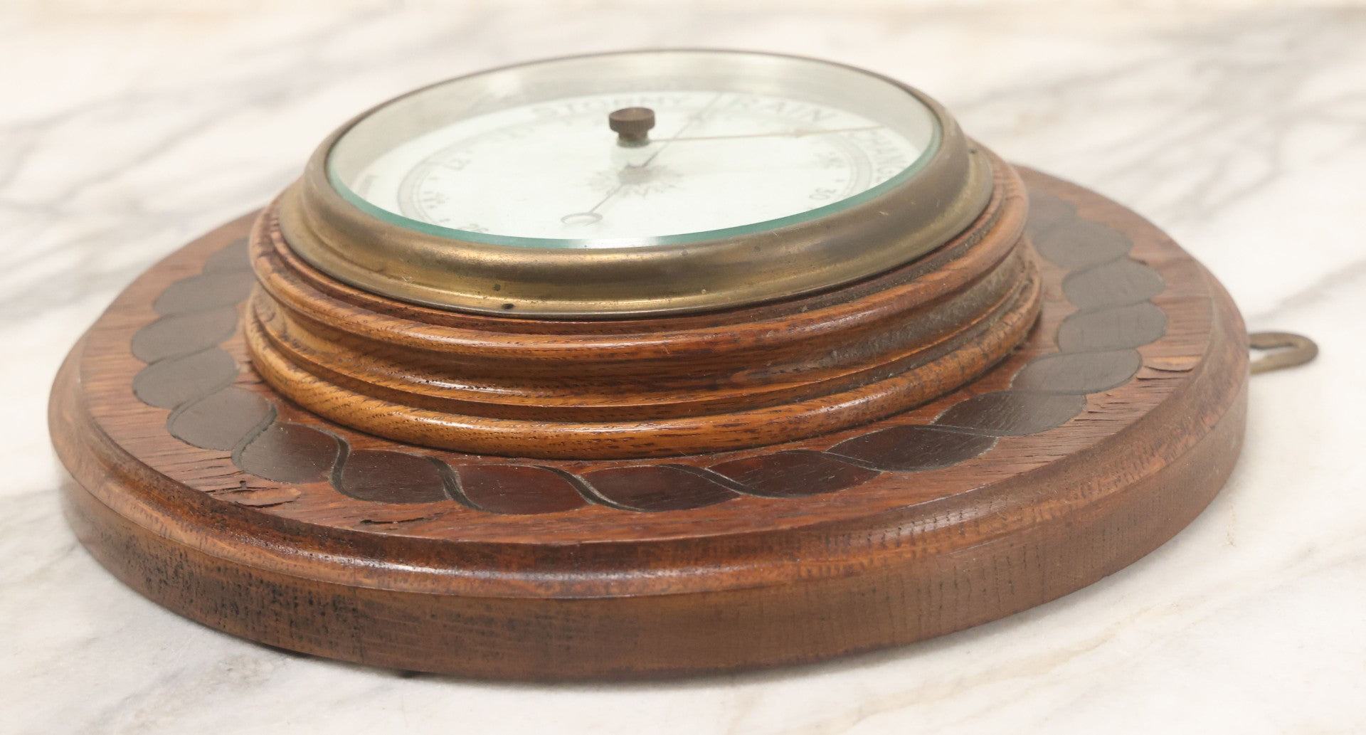 Lot 022 - Vintage Aneroid Barometer On Wood Plaque With Twisted Rope Inlay Motif, Beveled Glass Brass Surround, Wall Hanger, 9-3/4" Diameter