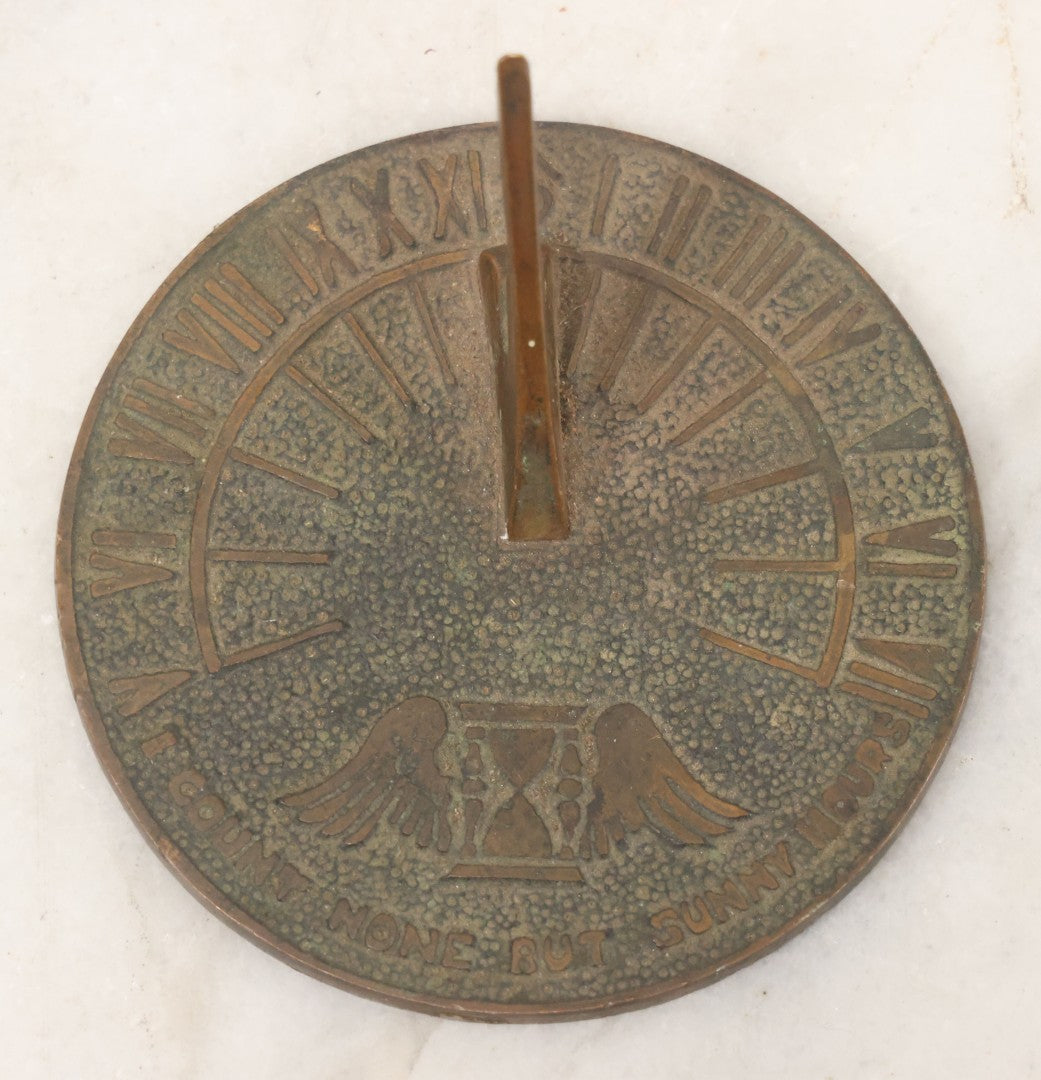 Lot 023 - Vintage Cast Brass Miniature Sundial With Winged Hourglass Motif, "I Count None But Sunny Hours" 3-3/8" Diameter