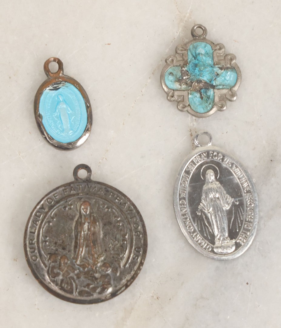 Lot 032 - Grouping Of Five Religious Devotional Smalls Including Prayer Card Of Unknown Nun With Lace Border, Four Metal Religious Charms