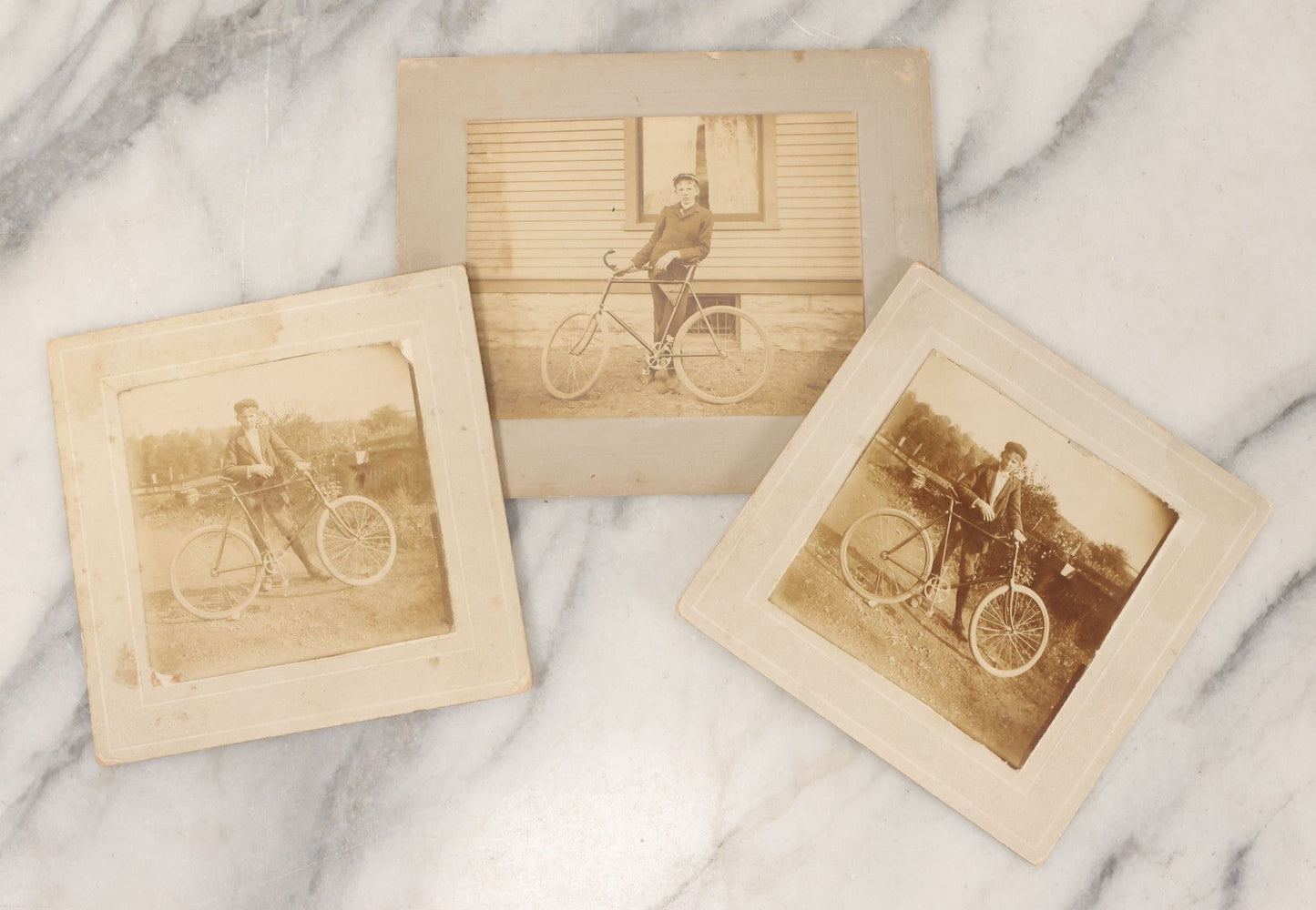 Lot 047 - Grouping Of Three Antique Boarded Photographs Of A Young Boy Identified As Oscar E. Benson Posing With His White-Wheeled Bicycle