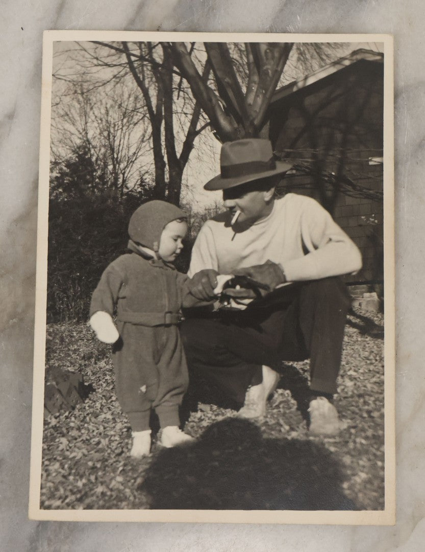 Lot 050 - Antique Unmounted Photograph Of A Father Smoking A Cigarette Showing His Young Son How To Hold A Pistol