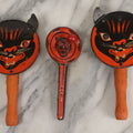 Lot 062 - Grouping Of Three Vintage Tin Lithograph Halloween Noisemakers Including Snarling Black Cat With Paper Ears Noise Making Eyeballs Marked T.C., Made In U.S.A., And Black Cat With Bats Border