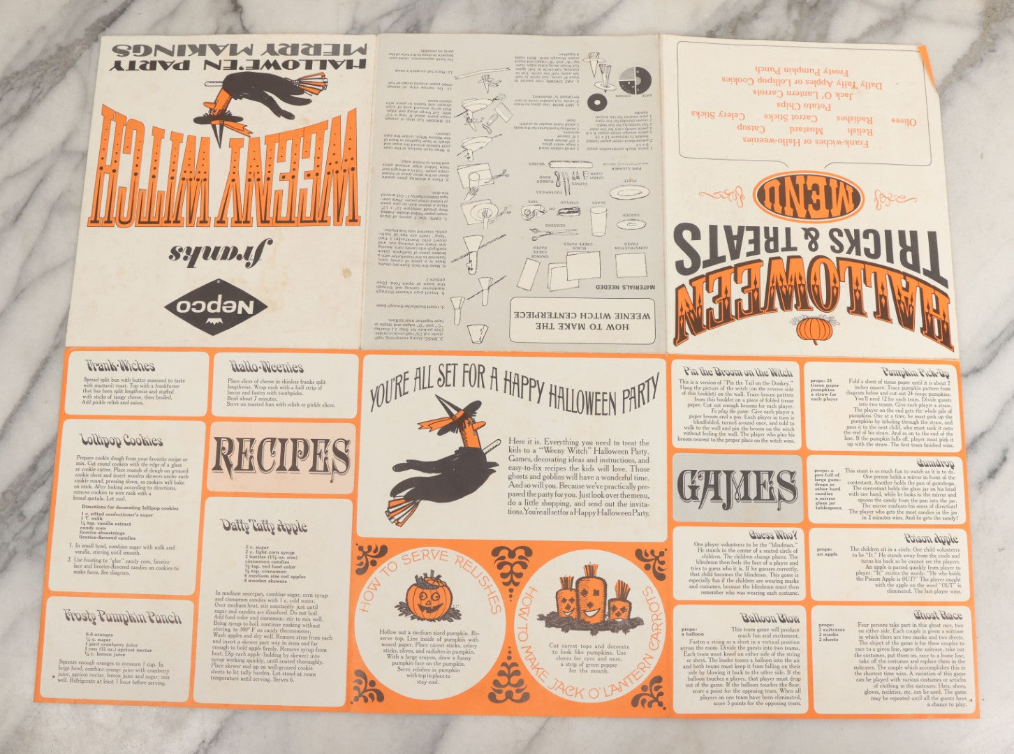 Lot 068 - Vintage "Franks Weeny Witch Hallowe'en Party Merry Makings" Fold Out Pin-The-Broom-On-The-Witch Poster And Halloween Party "Tricks And Treats Menu" With Recipes Including Brooms By Nepco