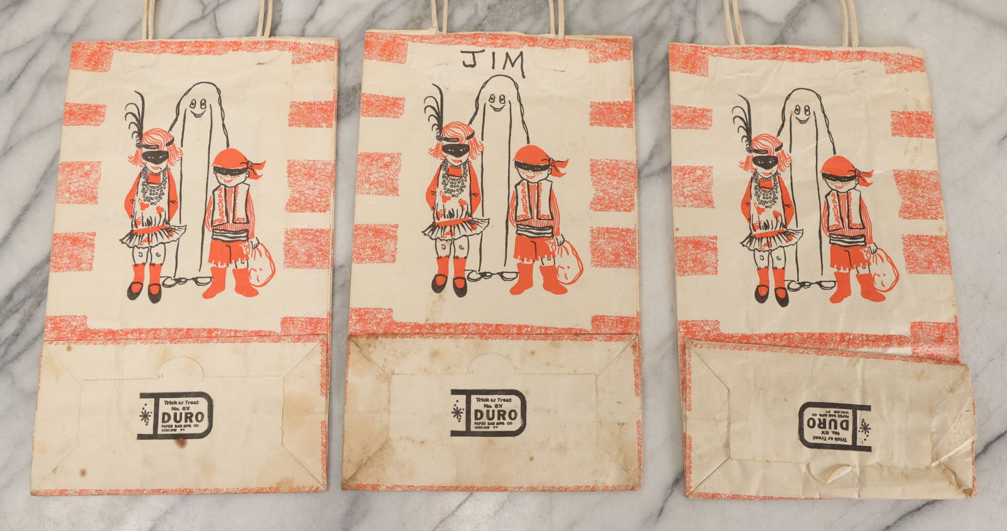 Lot 070 - Grouping Of Three "Trick Or Treat" Halloween Paper Bags With Ghost, Children In Costumes With Names Written In Sharpie Made By Duro Paper Bag Manufacturing Co., Ludlow, Kentucky, Trick Or Treat Design No. 6X