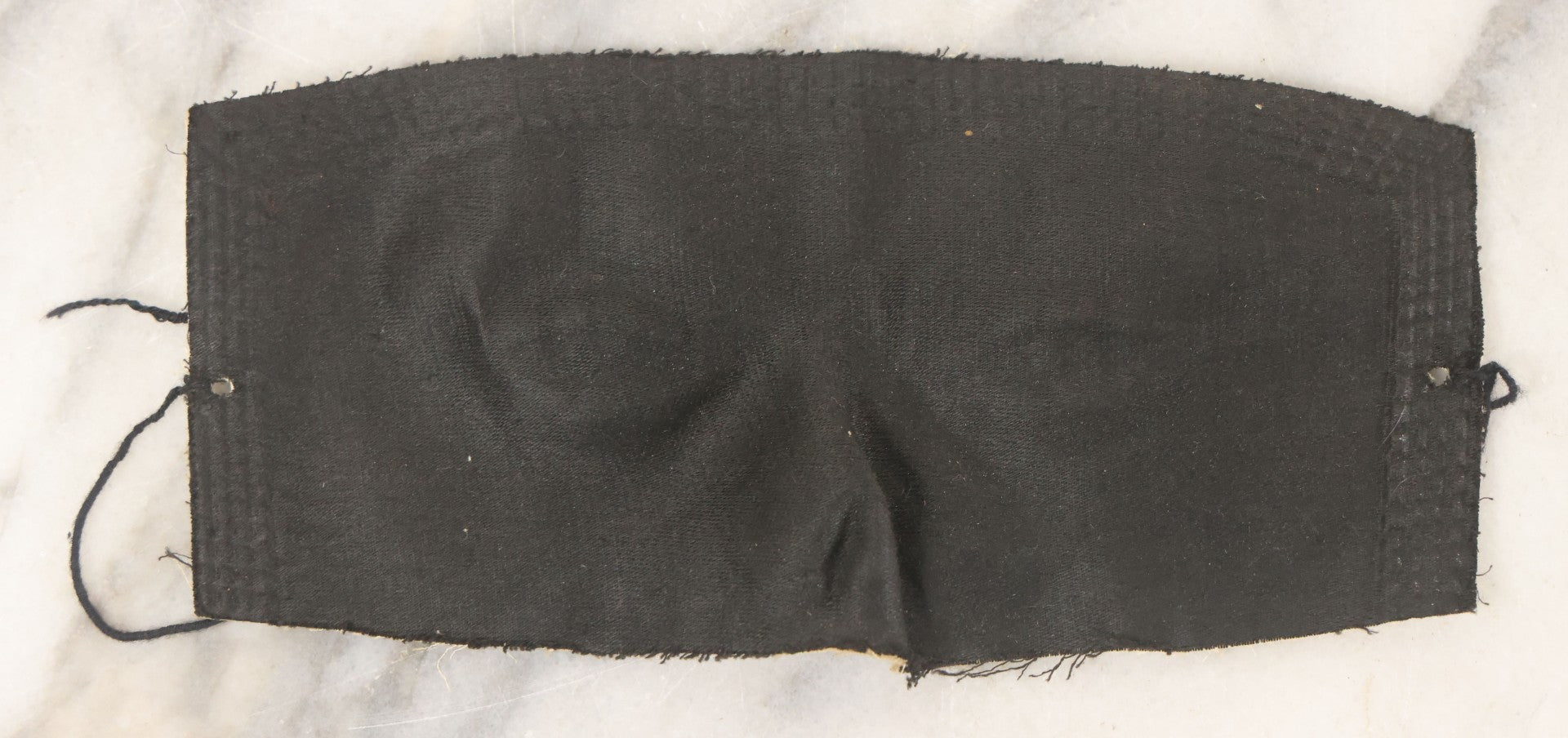 Lot 076 - Pair Of Antique Black Fabric Masks With Molded Eyes And Noses