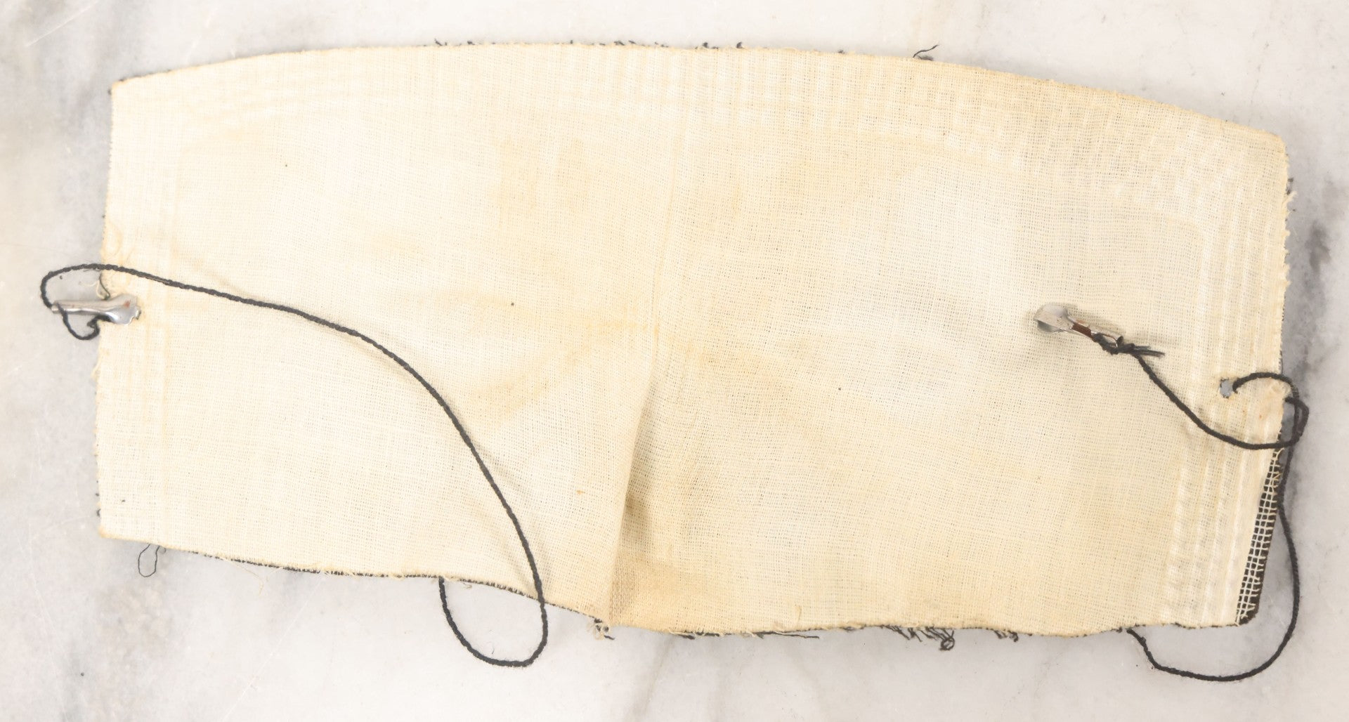 Lot 076 - Pair Of Antique Black Fabric Masks With Molded Eyes And Noses