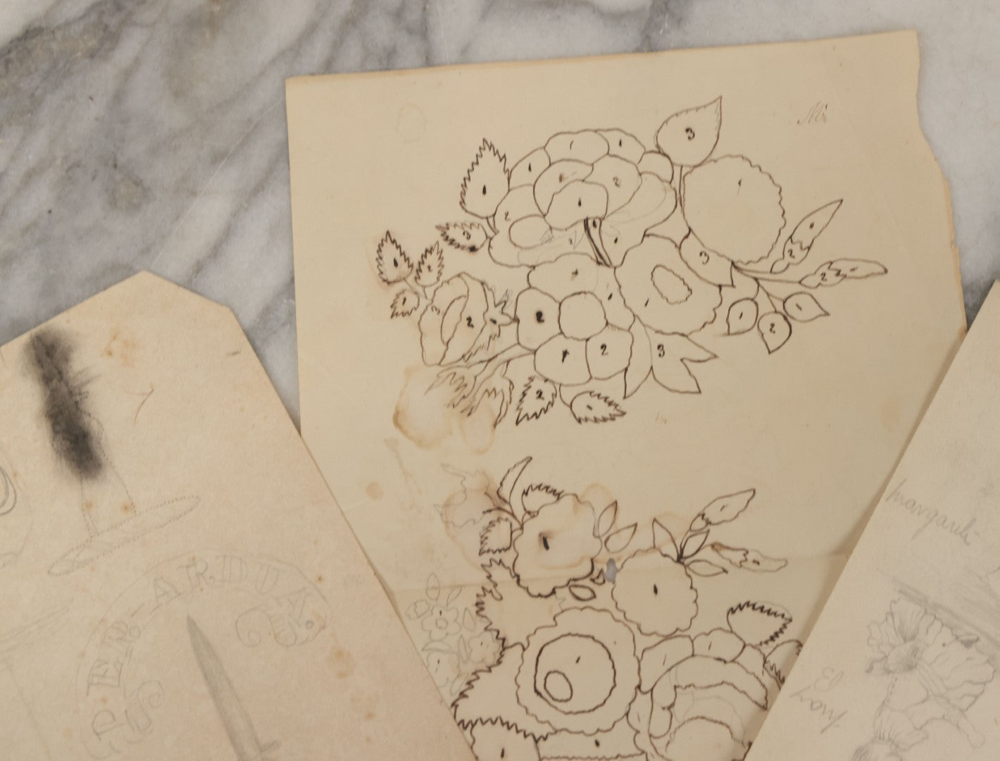 Lot 102 - Grouping Of Three Unframed Pencil And Pen Studies Including Family Crest, Flower Bouquet, And Little Girl, Circa 1885