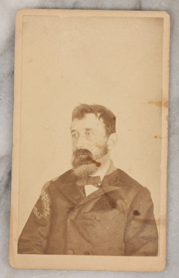 Lot 001 - Antique Carte De Visite C.D.V. Spirit Photograph Taken By William Mumler Of Dr. J.E. Parsons, With Faint Spirit Of Woman Embracing Subject, Back Marked "Specialty By Mumler. 170 West Springfield St., Boston, Mass" Note Foxing, Wear, Markings