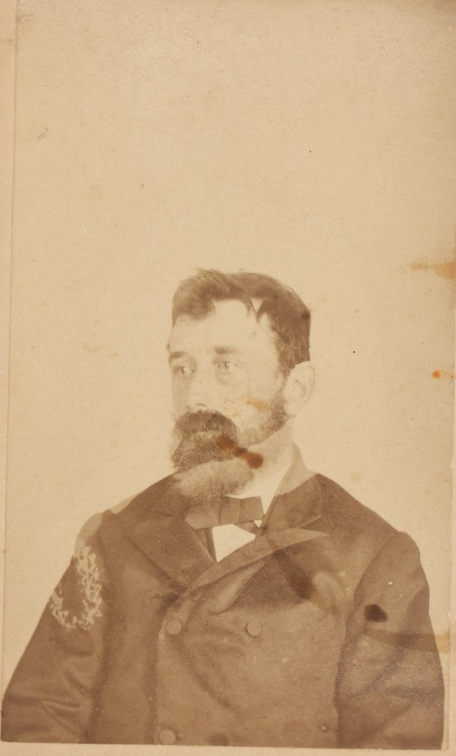 Lot 001 - Antique Carte De Visite C.D.V. Spirit Photograph Taken By William Mumler Of Dr. J.E. Parsons, With Faint Spirit Of Woman Embracing Subject, Back Marked "Specialty By Mumler. 170 West Springfield St., Boston, Mass" Note Foxing, Wear, Markings