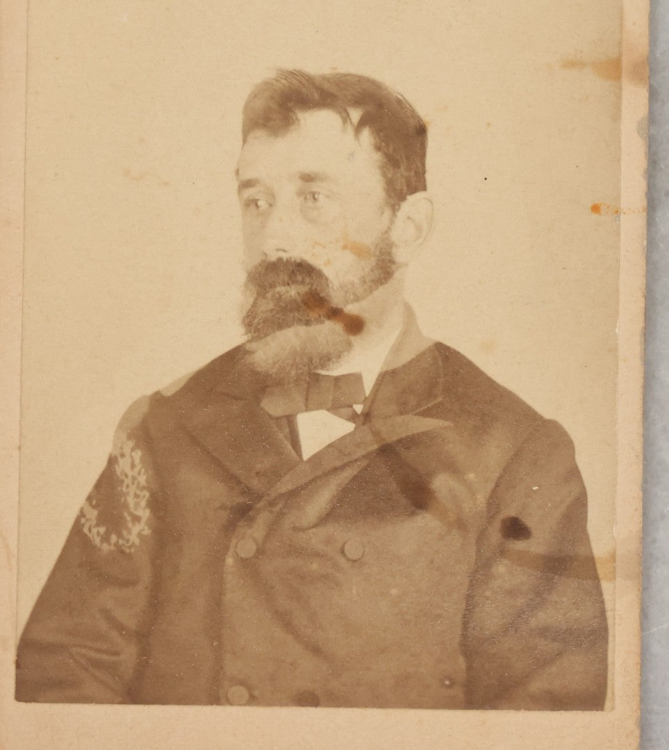 Lot 001 - Antique Carte De Visite C.D.V. Spirit Photograph Taken By William Mumler Of Dr. J.E. Parsons, With Faint Spirit Of Woman Embracing Subject, Back Marked "Specialty By Mumler. 170 West Springfield St., Boston, Mass" Note Foxing, Wear, Markings