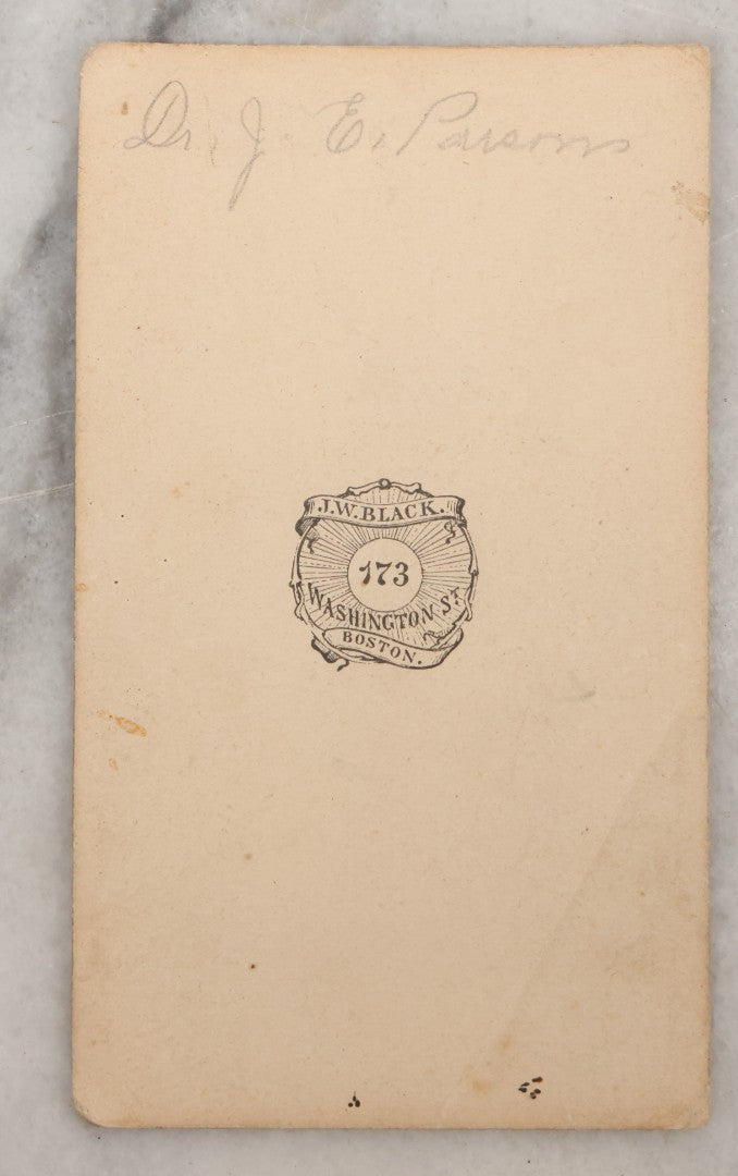 Lot 001 - Antique Carte De Visite C.D.V. Spirit Photograph Taken By William Mumler Of Dr. J.E. Parsons, With Faint Spirit Of Woman Embracing Subject, Back Marked "Specialty By Mumler. 170 West Springfield St., Boston, Mass" Note Foxing, Wear, Markings