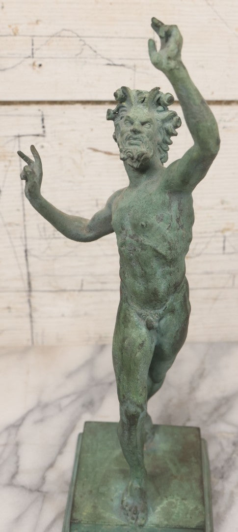Lot 007 - Antique Cast Metal Nude Mythological Pan Statue In Victory Triumph Pose With Tail, Horns, Green Patina, 12-1/4" Height
