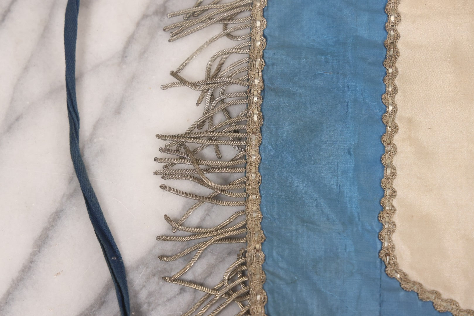 Lot 010 - Antique Odd Fellows I.O.O.F. Fraternal Apron With Embroidered Crossed Swords And Hand Painted All-Seeing-Eye Motifs, Silver Toned Fringe, Blue Coloring