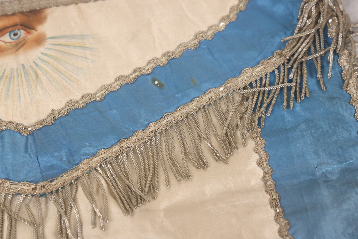 Lot 010 - Antique Odd Fellows I.O.O.F. Fraternal Apron With Embroidered Crossed Swords And Hand Painted All-Seeing-Eye Motifs, Silver Toned Fringe, Blue Coloring