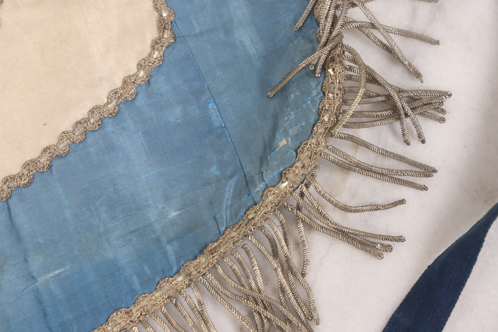 Lot 010 - Antique Odd Fellows I.O.O.F. Fraternal Apron With Embroidered Crossed Swords And Hand Painted All-Seeing-Eye Motifs, Silver Toned Fringe, Blue Coloring