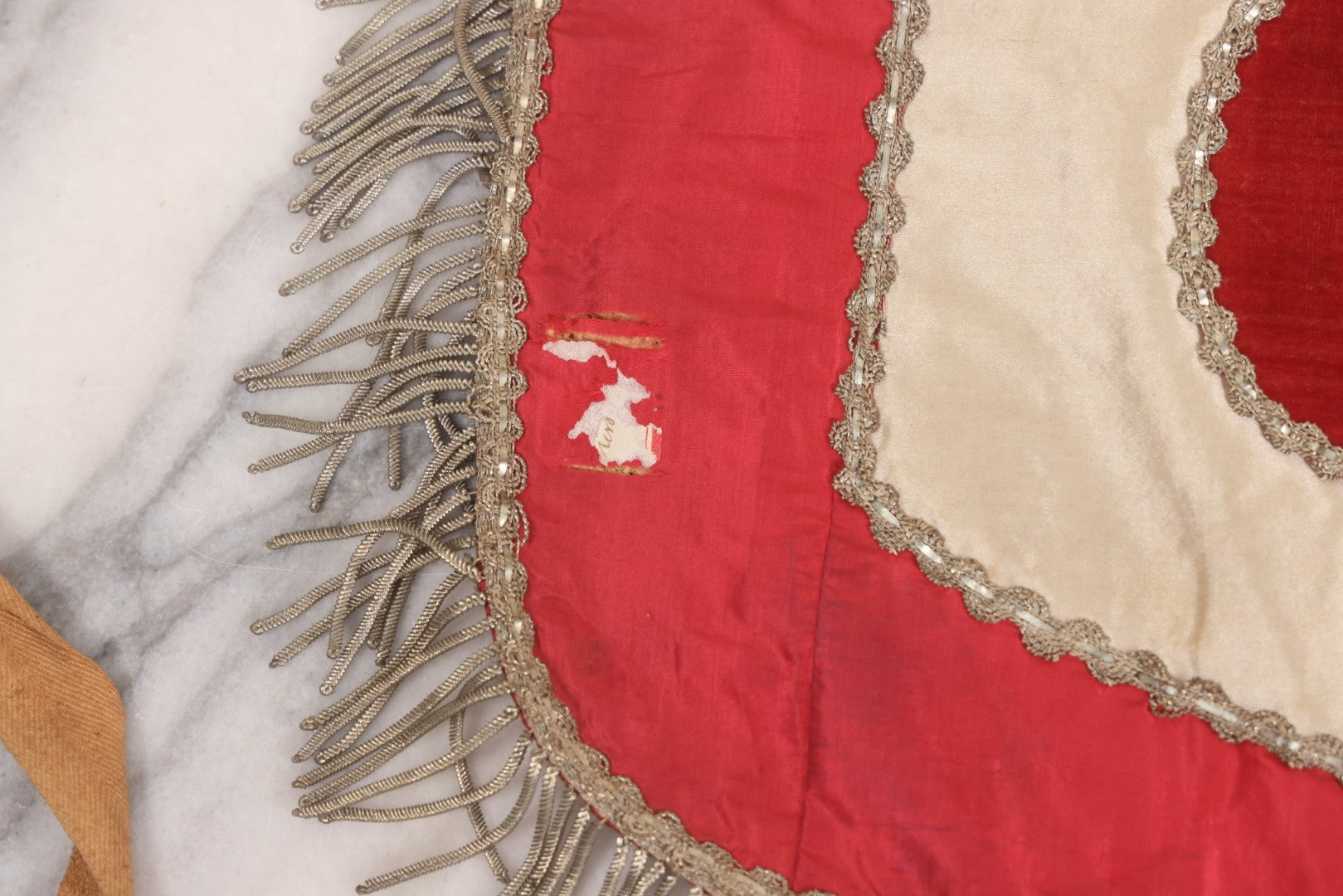 Lot 011 - Antique Odd Fellows I.O.O.F. Fraternal Apron With Embroidered Crossed Swords And Hand Painted All-Seeing-Eye Motifs, Silver Toned Fringe, Red Coloring