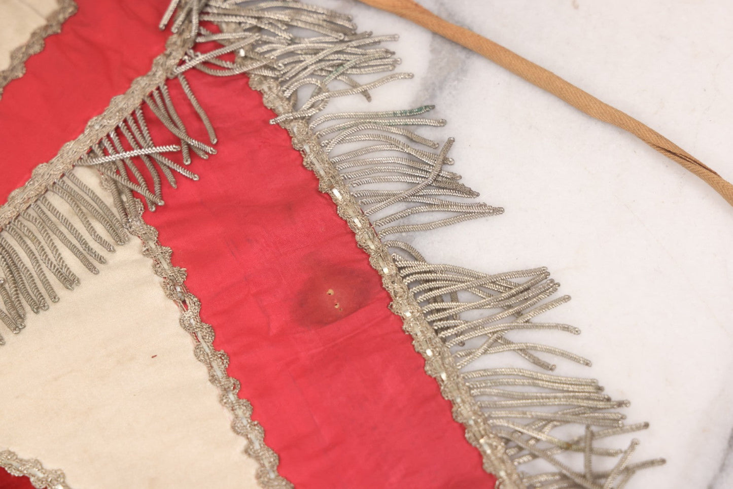 Lot 011 - Antique Odd Fellows I.O.O.F. Fraternal Apron With Embroidered Crossed Swords And Hand Painted All-Seeing-Eye Motifs, Silver Toned Fringe, Red Coloring