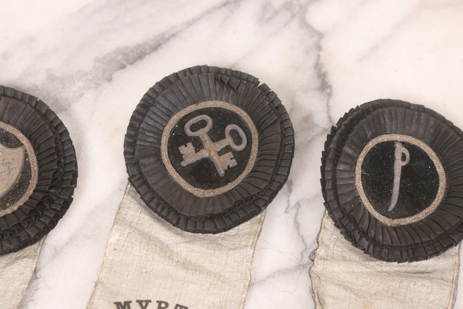Lot 013 - Grouping Of 15+ Antique Knights Of Pythias Fraternal Badges And Ribbons With Black Coloring, White Ribbons With Black Veil Covering, Pressed Metal Insignia, Myrtle Lodge No. 19, K.P., Kennebunk, Maine