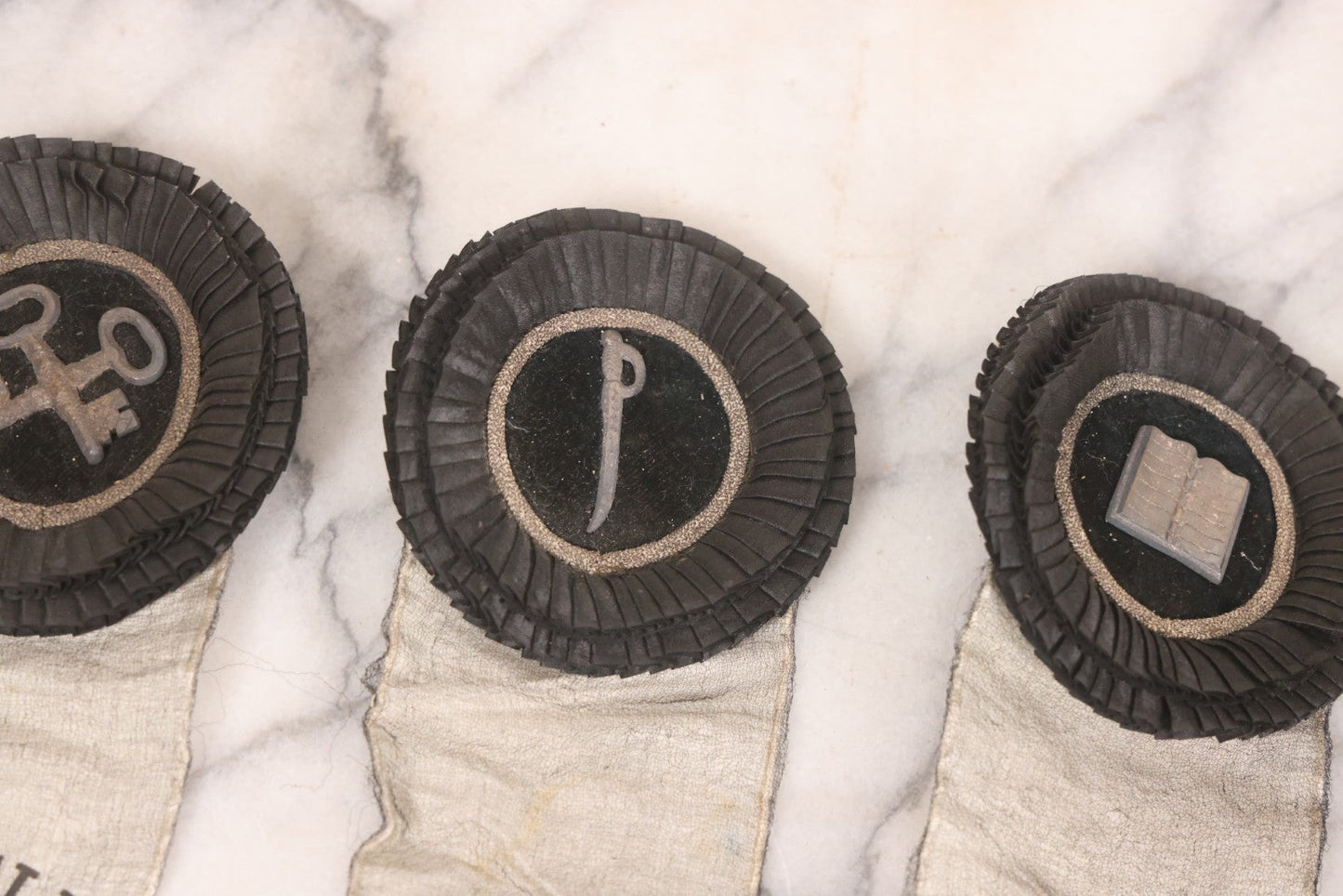 Lot 013 - Grouping Of 15+ Antique Knights Of Pythias Fraternal Badges And Ribbons With Black Coloring, White Ribbons With Black Veil Covering, Pressed Metal Insignia, Myrtle Lodge No. 19, K.P., Kennebunk, Maine