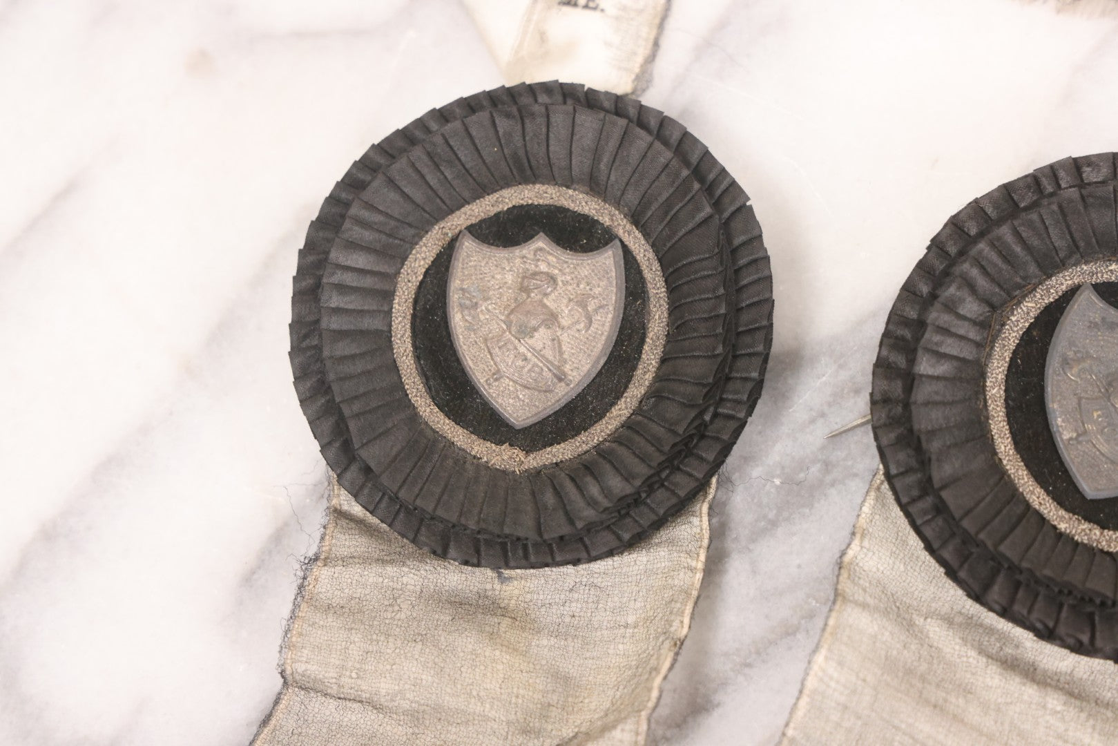 Lot 013 - Grouping Of 15+ Antique Knights Of Pythias Fraternal Badges And Ribbons With Black Coloring, White Ribbons With Black Veil Covering, Pressed Metal Insignia, Myrtle Lodge No. 19, K.P., Kennebunk, Maine