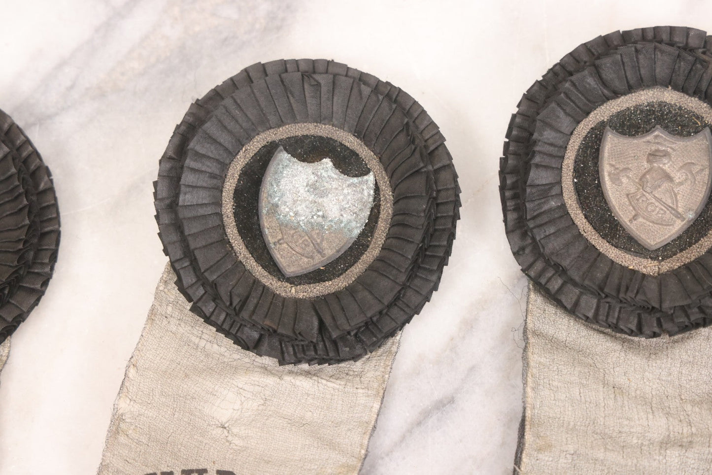 Lot 013 - Grouping Of 15+ Antique Knights Of Pythias Fraternal Badges And Ribbons With Black Coloring, White Ribbons With Black Veil Covering, Pressed Metal Insignia, Myrtle Lodge No. 19, K.P., Kennebunk, Maine