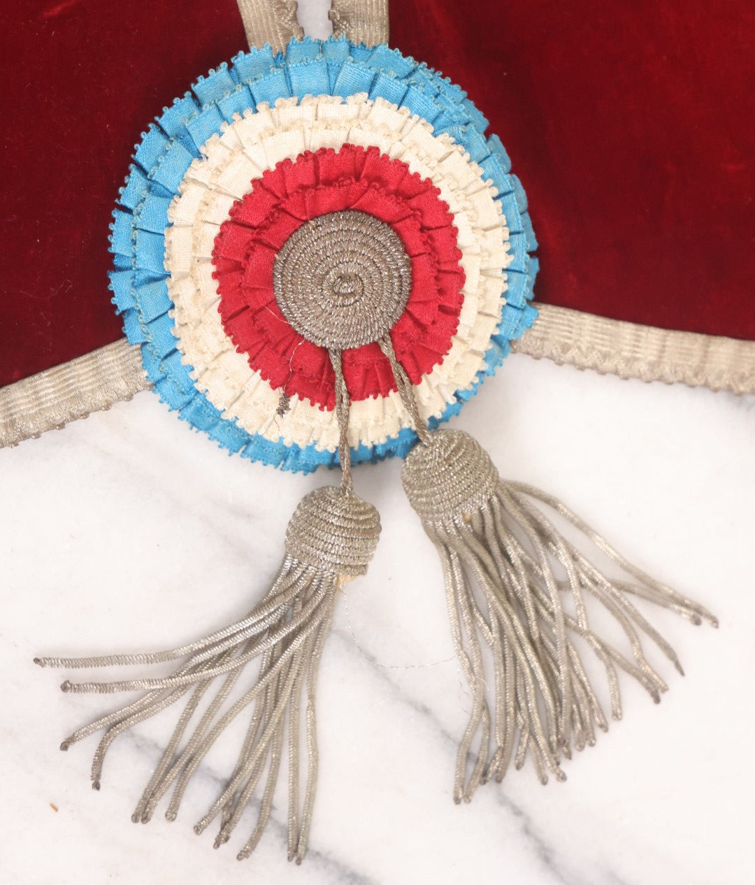 Lot 014 - Single Antique Fraternal Sash Collar With Red Coloring, Red, White, And Blue Fabric Medallion, And Silver Colored Tassels