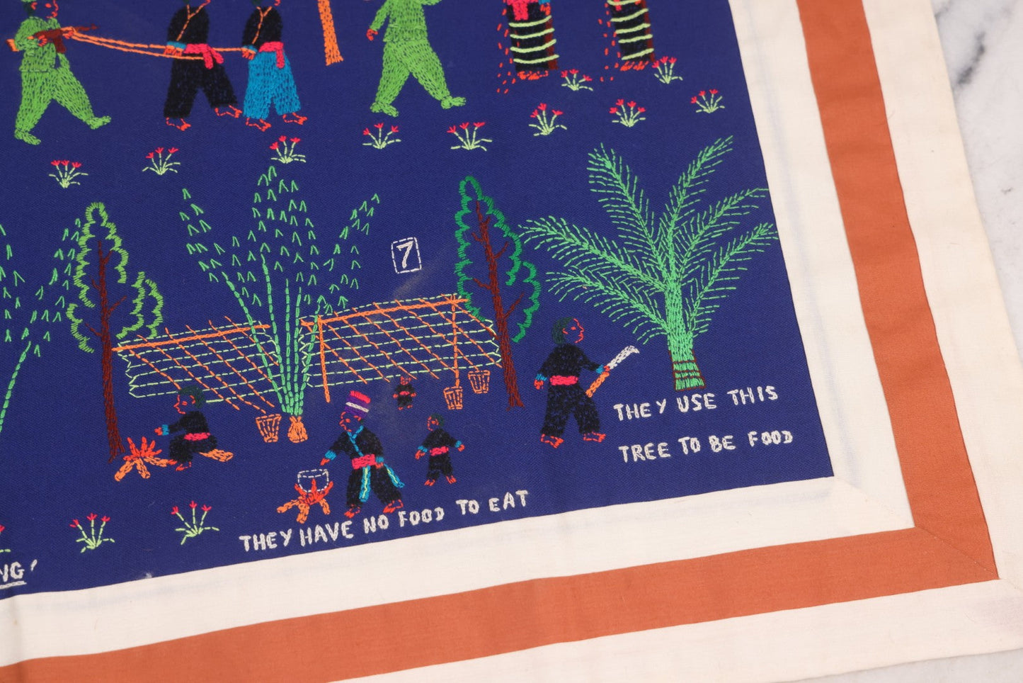 Lot 017 - Pair Of Vintage Folk Art Embroidered Hmong Story Cloths (Paj Ntaub) Illustrating "The War In Laos Since 1976" Across 13 Scenes, Artist Signed Mee Xiong, With Gallery Label From Cama Crafts, Made In Thailand, Circa 1990s