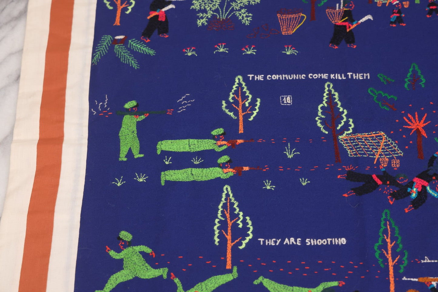 Lot 017 - Pair Of Vintage Folk Art Embroidered Hmong Story Cloths (Paj Ntaub) Illustrating "The War In Laos Since 1976" Across 13 Scenes, Artist Signed Mee Xiong, With Gallery Label From Cama Crafts, Made In Thailand, Circa 1990s