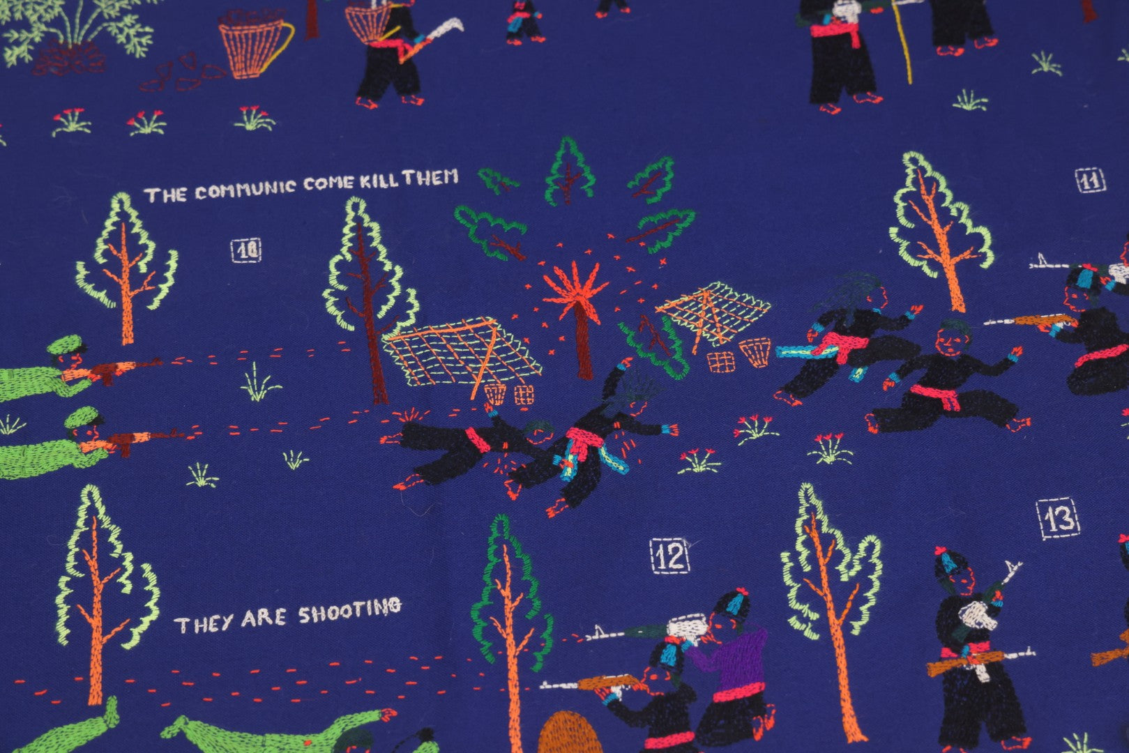 Lot 017 - Pair Of Vintage Folk Art Embroidered Hmong Story Cloths (Paj Ntaub) Illustrating "The War In Laos Since 1976" Across 13 Scenes, Artist Signed Mee Xiong, With Gallery Label From Cama Crafts, Made In Thailand, Circa 1990s