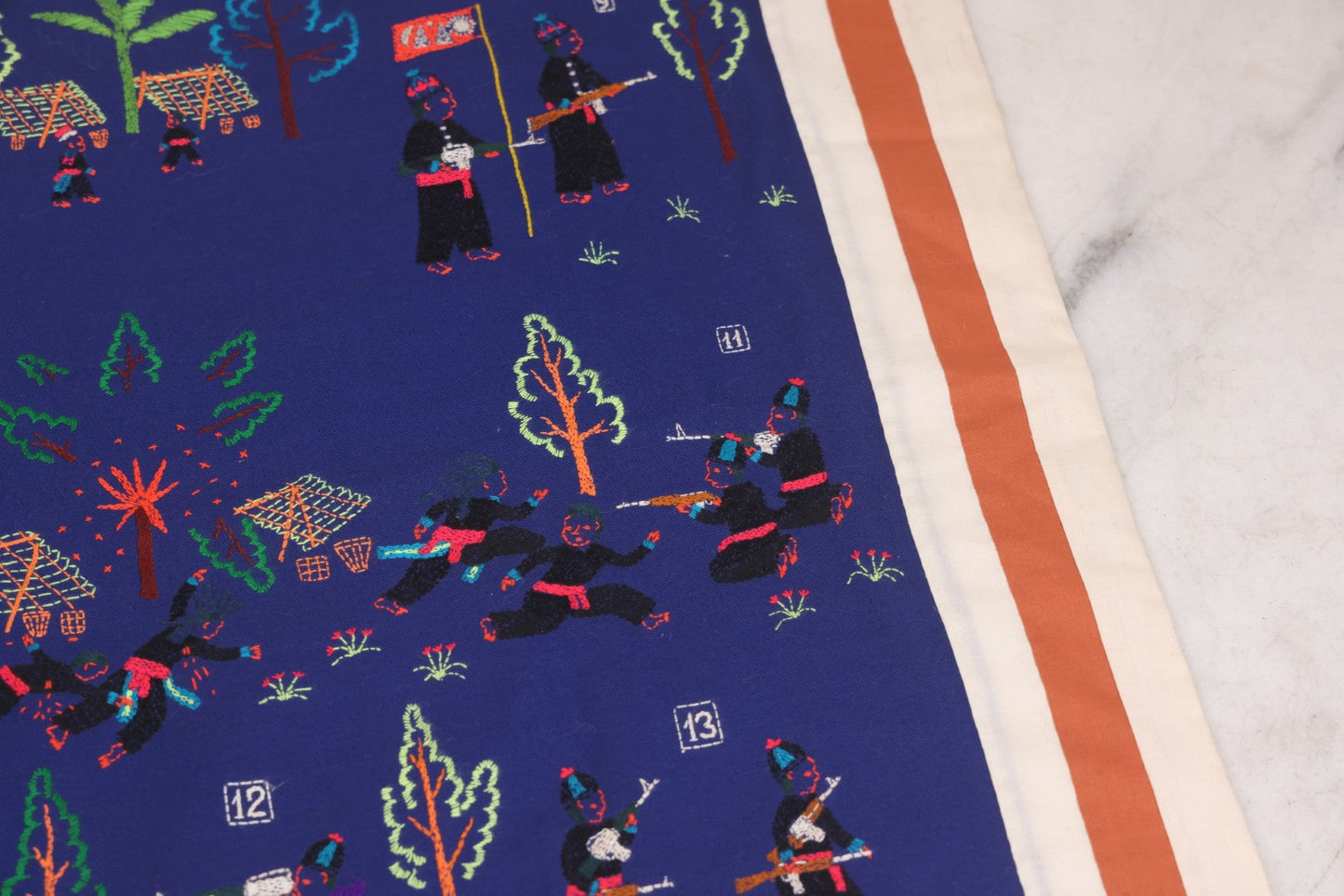 Lot 017 - Pair Of Vintage Folk Art Embroidered Hmong Story Cloths (Paj Ntaub) Illustrating "The War In Laos Since 1976" Across 13 Scenes, Artist Signed Mee Xiong, With Gallery Label From Cama Crafts, Made In Thailand, Circa 1990s