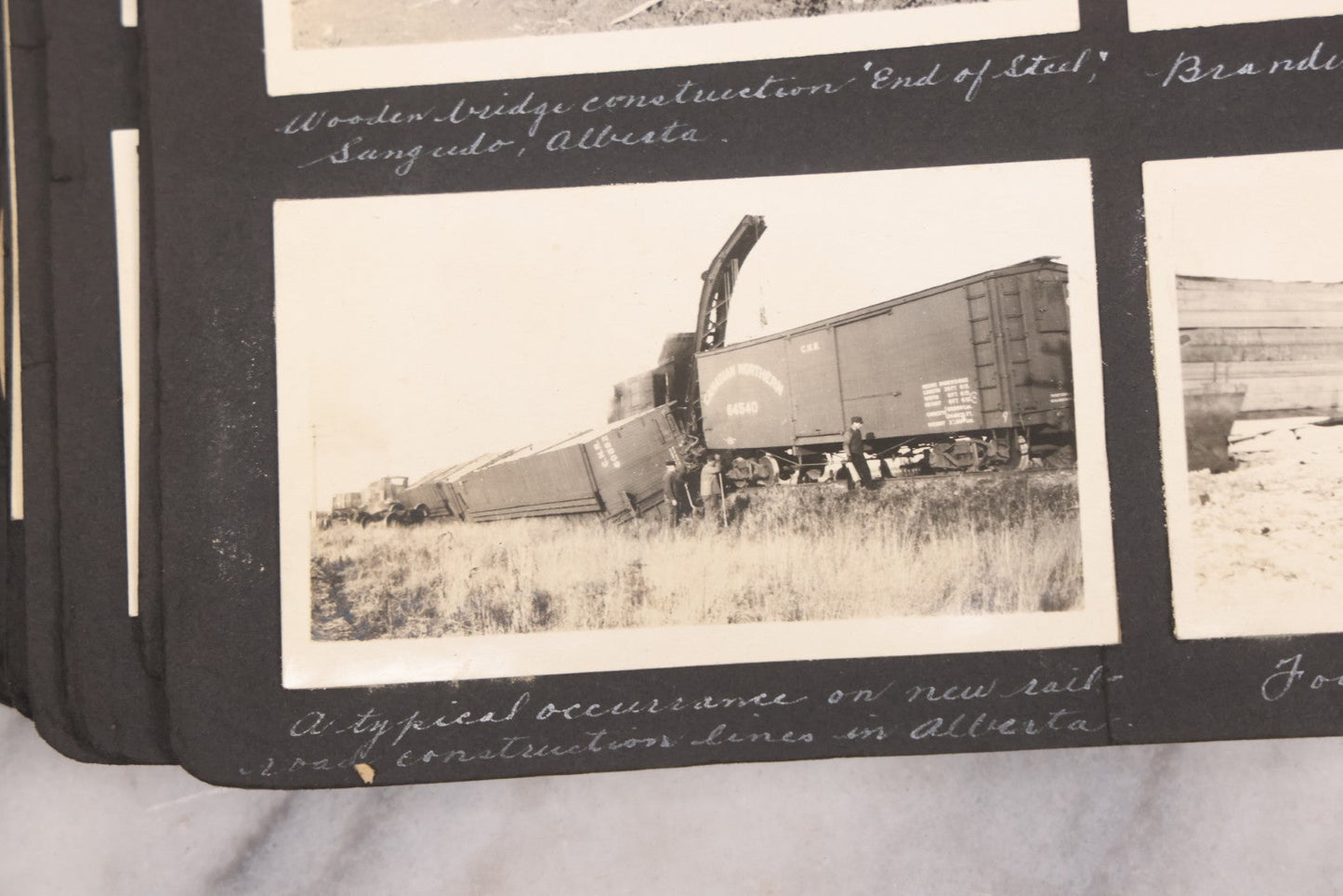 Lot 021 - Antique Snapshot Photo Album Containing 250+ Photographs Including Many Photos Of British Columbia, Railroad Accident, Bears And Bear Hunting, Animals, Cars, And Children, Circa 1905-1920, Note Pages Loose, No Covers