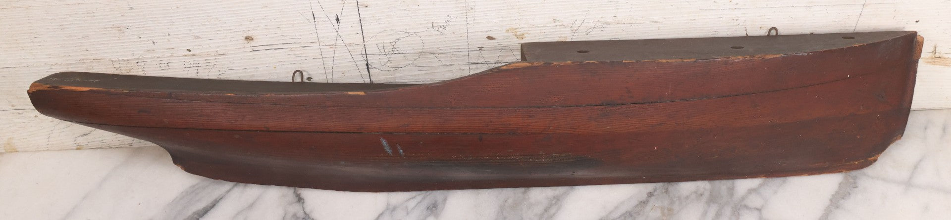 Lot 022 - Vintage Folk Art Wooden Ship Half-Hull Model Body Cross Section For Wall Display, Solid Wood Construction, Three Drilled Holes In Front Bow For Masts, Note Chipping And Cracks Throughout, 30" Length