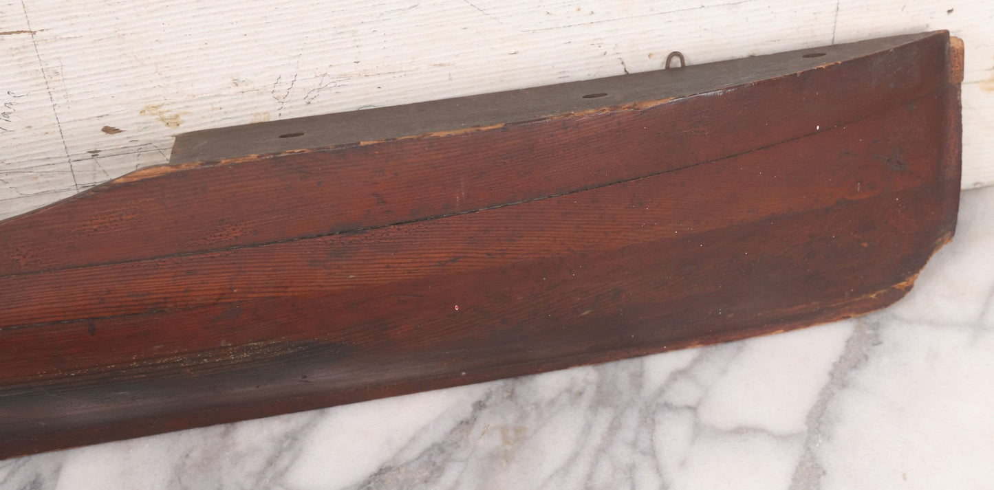 Lot 022 - Vintage Folk Art Wooden Ship Half-Hull Model Body Cross Section For Wall Display, Solid Wood Construction, Three Drilled Holes In Front Bow For Masts, Note Chipping And Cracks Throughout, 30" Length