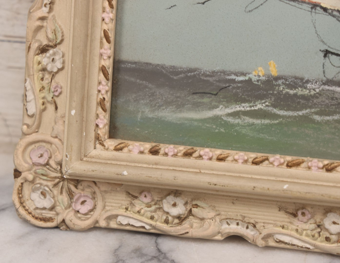 Lot 024 - Antique Nautical Pastel Painting Of A Sailing Ship On Choppy Waters, With Coastal Mountains, Other Ships In Background, Artist Signed M. Dulmy, In Original Painted Pressed Gesso Custom Frame, 23" x 9"