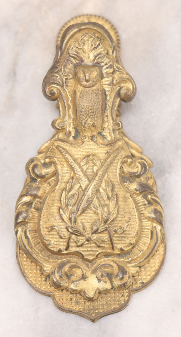 Lot 029 - Antique Victorian Pressed Brass Paperclip With Owl, Crossed Quills Motifs, Manufactured By W. Dowler, Birmingham, England, 4-7/8" Height