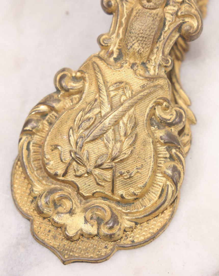 Lot 029 - Antique Victorian Pressed Brass Paperclip With Owl, Crossed Quills Motifs, Manufactured By W. Dowler, Birmingham, England, 4-7/8" Height