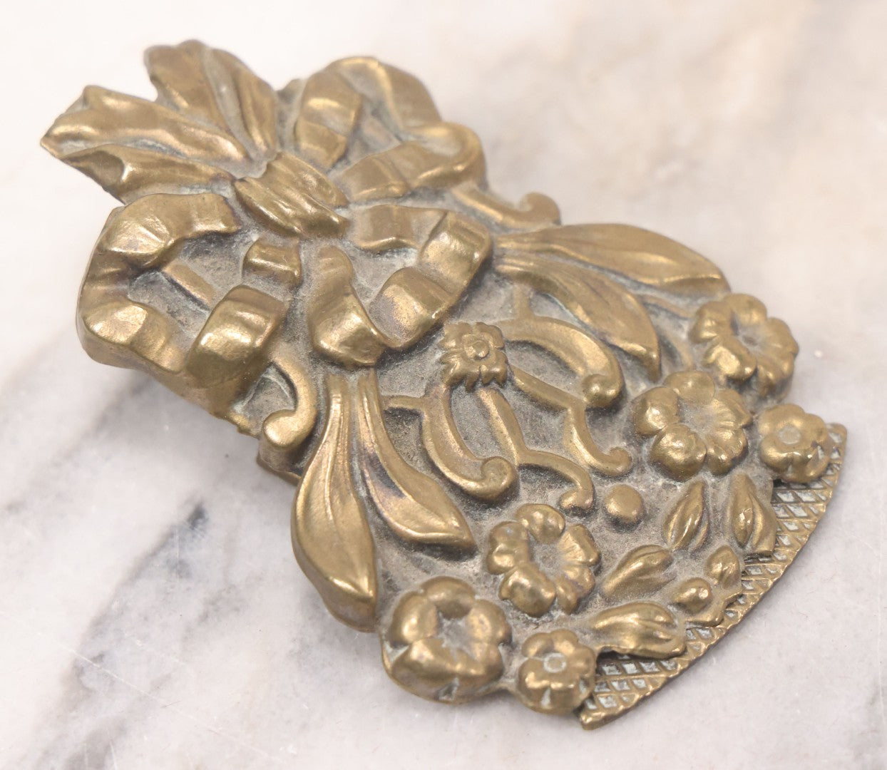 Lot 030 - Antique Victorian Pressed Brass Paperclip With Bow And Flower Bouquet Motifs, Illegible Manufacturer's Mark, 3-3/8" Height