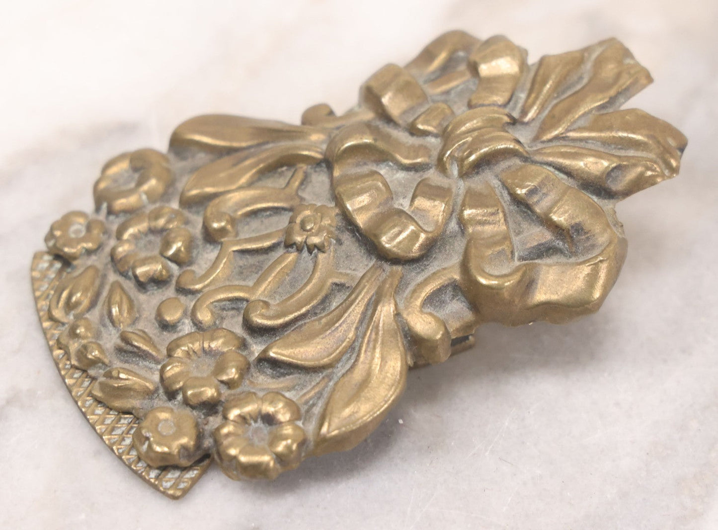 Lot 030 - Antique Victorian Pressed Brass Paperclip With Bow And Flower Bouquet Motifs, Illegible Manufacturer's Mark, 3-3/8" Height