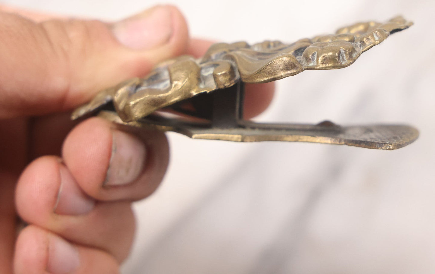 Lot 030 - Antique Victorian Pressed Brass Paperclip With Bow And Flower Bouquet Motifs, Illegible Manufacturer's Mark, 3-3/8" Height