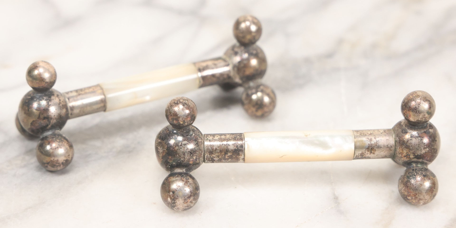 Lot 037 - Pair Of Antique Silverplate And Mother Of Pearl Knife Rests, 3-1/2" Long Each