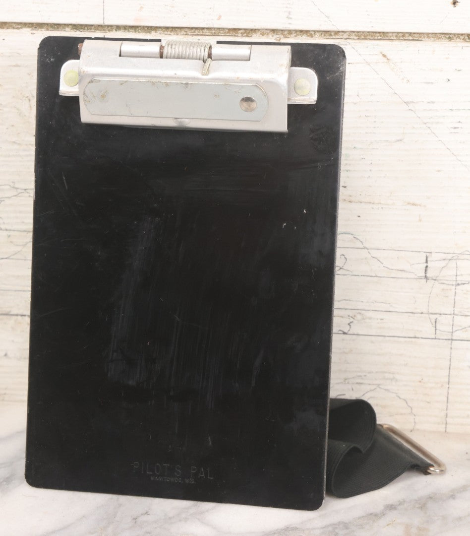 Lot 048 - Vintage "Pilot's Pal" Metal Clipboard With Ergonomic Design And Thigh Strap For Pilot Use, Made In Manitowoc, Wisconsin