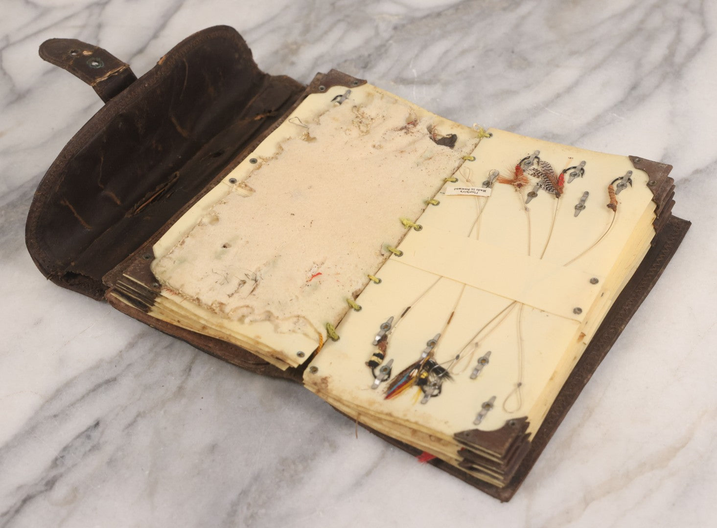 Lot 050 - Antique Leather Fly Fisherman's Wallet Book With Celluloid Pages, Many Fly Fishing Lures, Some Marked "Playfair's, Made In Scotland," Note Flies Have Varying Degrees Of Ware, Losses, As Found